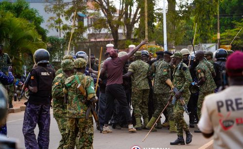 Ugandan opposition leader Bobi Wine surrounded by police during his campaign: PHOTO/facebook.com/www.bobiwine.ug