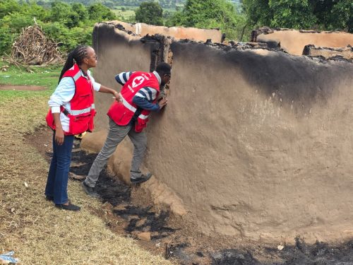 A Kenya Red Cross officers inspects the remains of a house destroyed in the Angata Barikkoi clashes. PHOTO/@KenyaRedCross/X
