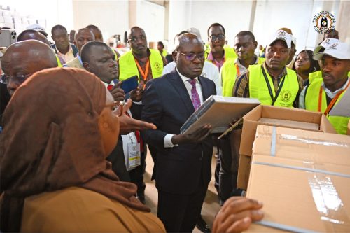 Officials oversee packed ballots. PHOTO/@UgandaEC/X