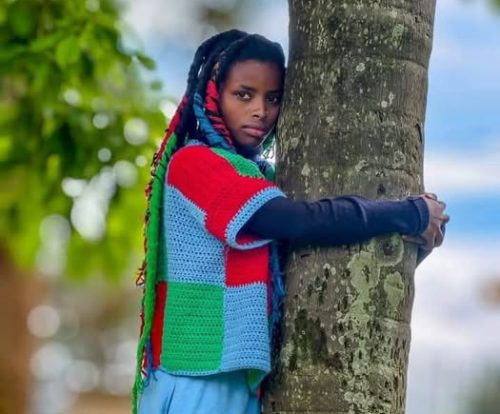 Truphena Muthoni hugging a tree. PHOTO/truphena_muthoni/Instagram