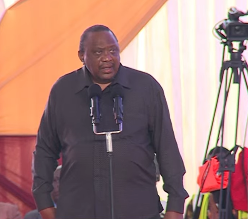 Retired President Uhuru Kenyatta addressing mourners during the burial ceremony of the late Cyrus Jirongo in Lumakanda, Kakamega County, on Tuesday, December 30, 2025. PHOTO/Screengrab by People Daily Digital from a video streamed on YouTube by K24 TV