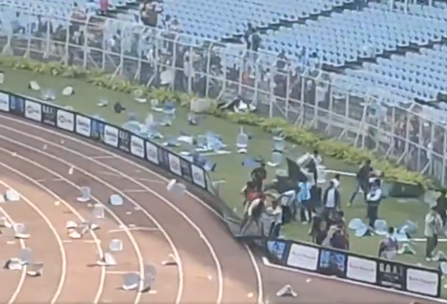 Angry fans attending Lionel Messi's tour of India rip up seats and throw items towards the pitch. PHOTO/Screengrab by People Daily Digital