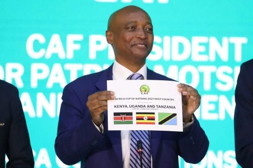 CAF President Patrice Motsepe displays the 2027 AFCON joint hosting certificate for Kenya, Uganda, and Tanzania. PHOTO/@MickyJnr__/X
