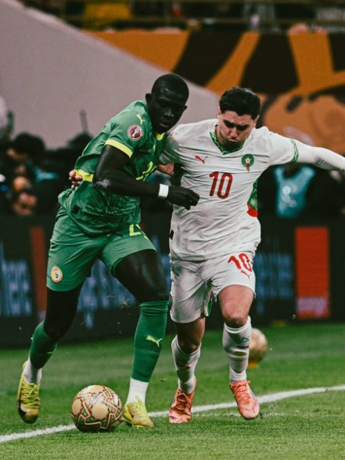 Sengalese player battle for the ball with a Moroccan player during the AFCON finals on January 18, 2026. PHOTO/@CAF_Online/X
