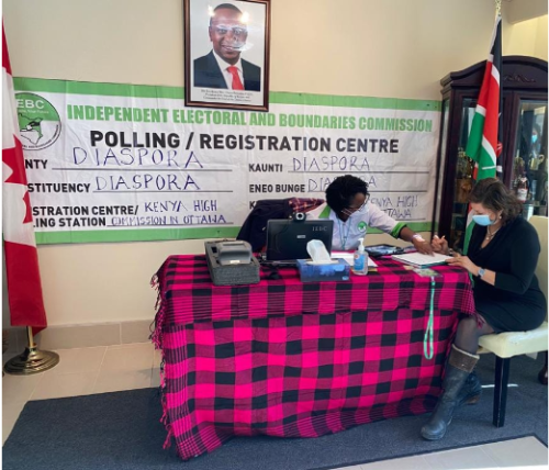 IEBC official guiding a Diaspora Voter at Kenya High Commission in Ottawa polling centre during 2022 General Elections. PHOTO/DBPF