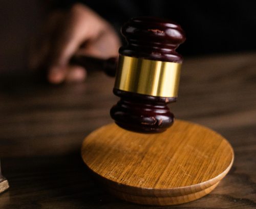Brown and Gold Gavel on Brown Wooden Table: PHOTO/Pexels