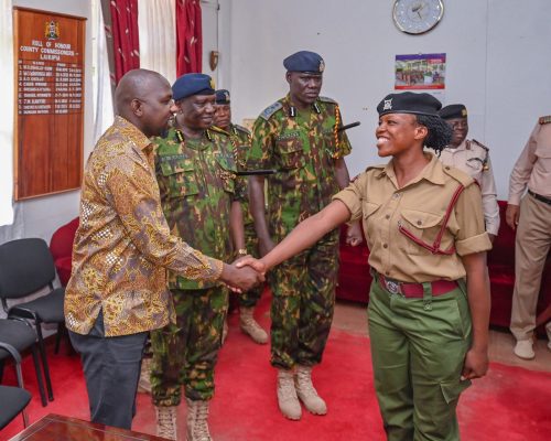 CS Murkomen shaking hands with the newly promoted Corporal Winfred Gacheri Kinoti. PHOTO/@kipmurkomen/X