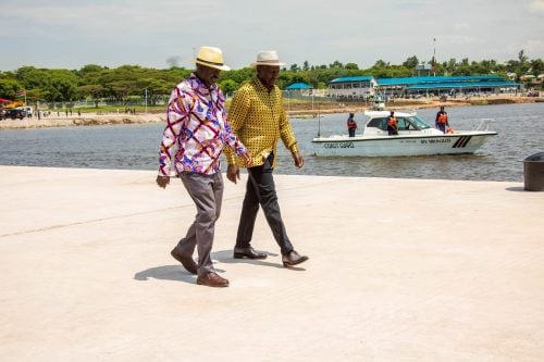 Raila Odinga and President William Ruto walk along the newly constructed Homa Bay Pier on May 30, 2025. PHOTO/@RailaOdinga/X