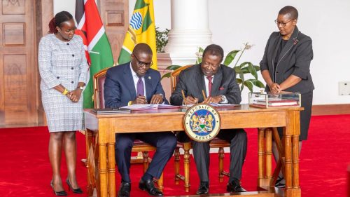 Nairobi Governor Johnson Sakaja and Prime Cabinet Secretary Musalia Mudavadi sign the Nairobi County cooperation agreement. PHOTO/State House
