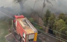 Early morning fire destroys stalls and goods of unknown value at Toi market