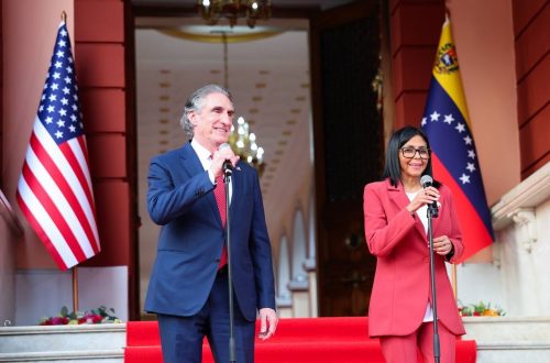 Venezuela's interim president Delcy Rodríguez (R) and US interior minister Doug Burgum. PHOTO/@delcyrodriguezv/X