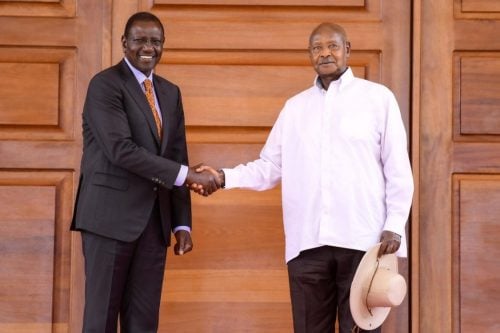 President William Ruto shakes hands with President Yoweri Museveni during a past event. PHOTO/@KagutaMuseveni/X