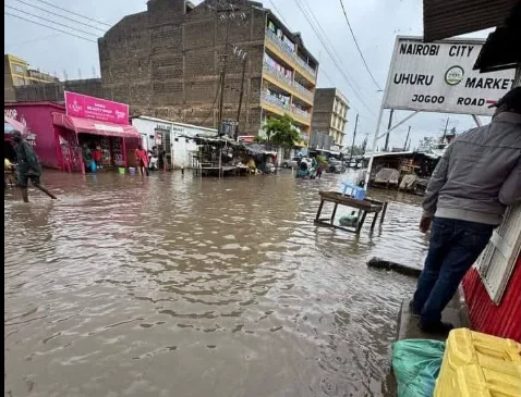 Floodwater wreaking havoc in Uhuru Market in Nairobi.PHOTO/https://www.facebook.com/RedCrossKE