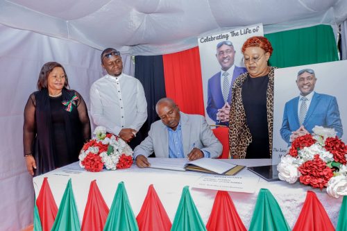 Deputy President Kithure Kindiki signs a condolence book during an interdenominational church service held at the late legislator’s rural home in Gachwe village. PHOTO/@_KithureKindiki/X
