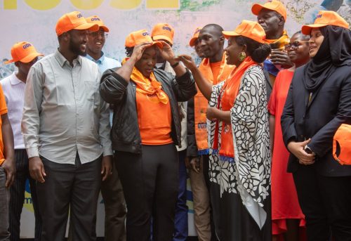 ODM Acting Secretary General Catherine Omanyo hands a party cap to Tina Ogal during her official entry into ODM. PHOTO/@TheODMparty/X