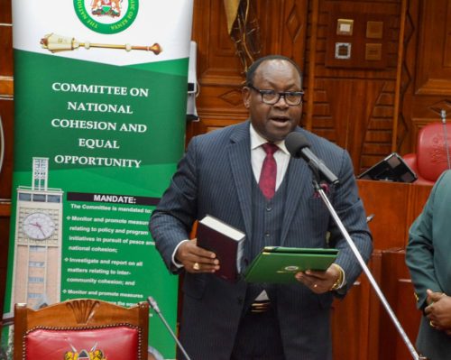 Kepha Omae taking an oath during the approval as NCIC chairperson. PHOTO/https://www.facebook.com/ParliamentKE