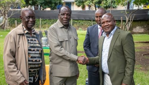 Cooperatives CS Wickliffe Oparanya shaking hands with Kakamega governor Fernandes Barasa after days of being at loggerheads. PHOTO//https://www.facebook.com/ODMparty