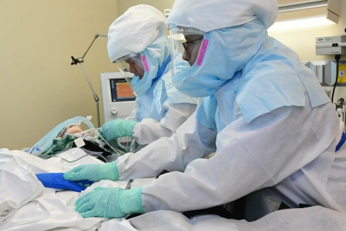 Healthcare workers in full PPE. PHOTO/@OCOCReport/X