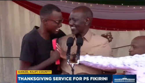 Ruto with the young man after he made it to the podium during a thanksgiving service in Ganze, Kilifi County. PHOTO/ Screengrab by People Daily Digital