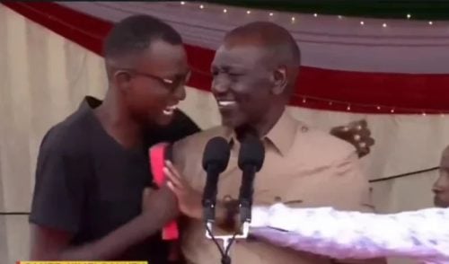 President William Ruto with the young man after he made it to the podium during a Thanksgiving service in Ganze, Kilifi County. PHOTO/Screengrab by People Daily Digital