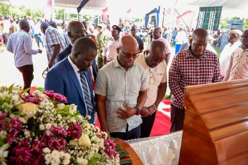 Nyando MP Jared Okello and Interior Principal Secretary Raymond Omollo during the viewing of the body of Okello’s mother ahead of her burial ceremony. PHOTO/Viola Kosome
