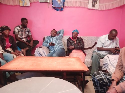 Charles Mwangi’s family at his house with friends during a media interview. PHOTO/Wanjira Wachira
