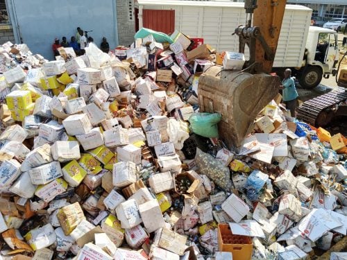 Illicit alcohol, cigarettes and other counterfeit goods being destroyed during a multi-agency crackdown led by KRA in Kisumu on June 30, 2026. PHOTO/Viola Kosome