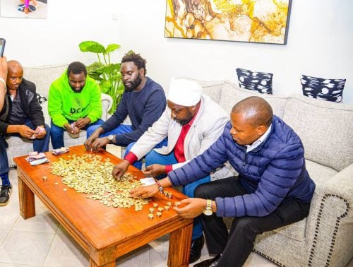 DCP Acting Secretary General John Methu leads the counting of the Ksh10 contributions for the party's candidate in upcoming Ol Kalou by-election. PHOTO/https://www.facebook.com/JohnMuhiaMethu