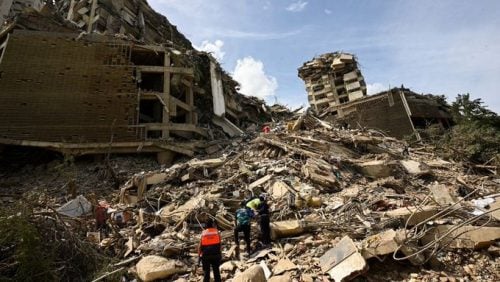Emergency services searched through rubble following the tremors in Caracas