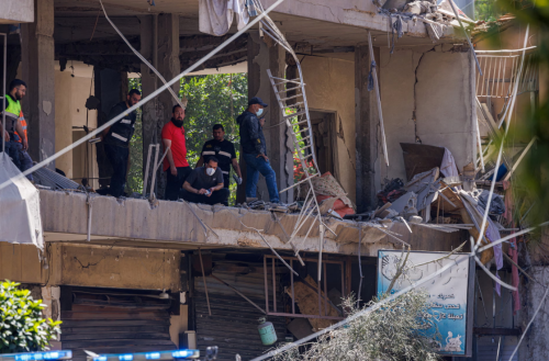 Police officers and emergency personnel work at the site of an Israeli strike on the southern suburbs of Beirut on Sunday. Photograph: Zohra Bensemra/Reuters