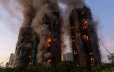 Seven people and two firms charged over Hong Kong deadly fire that killed 168