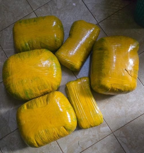 An image showing six bales of cannabis sativa wrapped in yellow tape. PHOTO/@NPSOfficial_KE/X