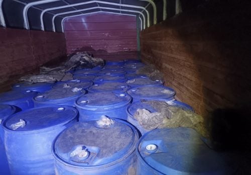 Blue drums arranged inside a lorry during a police operation in Umoja estate in Makongeni, Thika West Sub County. PHOTO/@DCI_Kenya/X