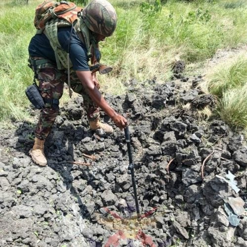 A Kenya Defence Forces (KDF) Explosive Ordnance Disposal specialist inspects the site of a neutralized pressure-plate IED during route clearance operations in Lamu County. PHOTO/@kdfinfo/X