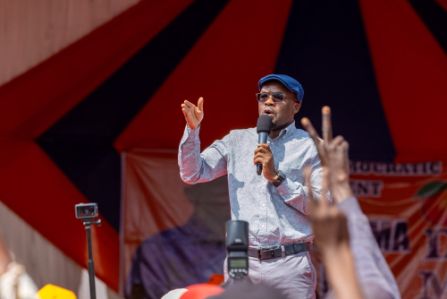 Interior Principal Secretary for Internal Security and National Administration Raymond Omollo addresses residents during the Siaya Women Economic Empowerment Forum and Celebration of Widows at Barkalare Primary School in Gem Constituency.PHOTO/Viola Kosome